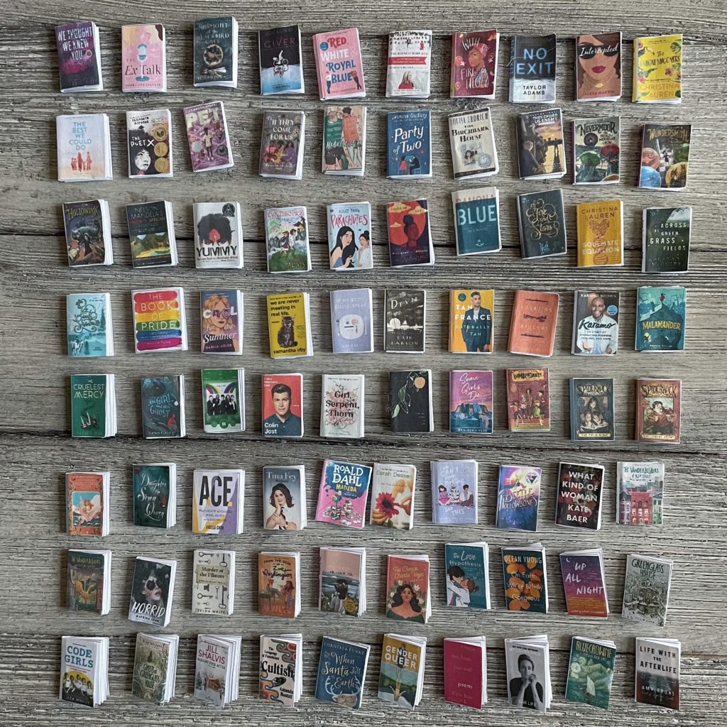 A flatlay of miniature paper versions of every book I read in 2021.